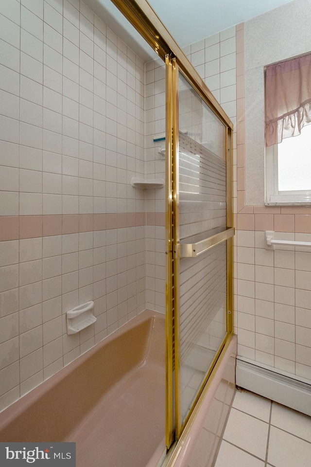 1402 Lehigh St, Allentown, PA 18103 - full bath featuring tile walls, tile patterned floors, a baseboard heating unit, and combined bath / shower with glass door