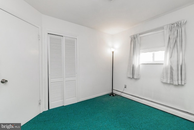 1402 Lehigh St, Allentown, PA 18103 - unfurnished bedroom featuring baseboard heating, carpet floors, and a closet