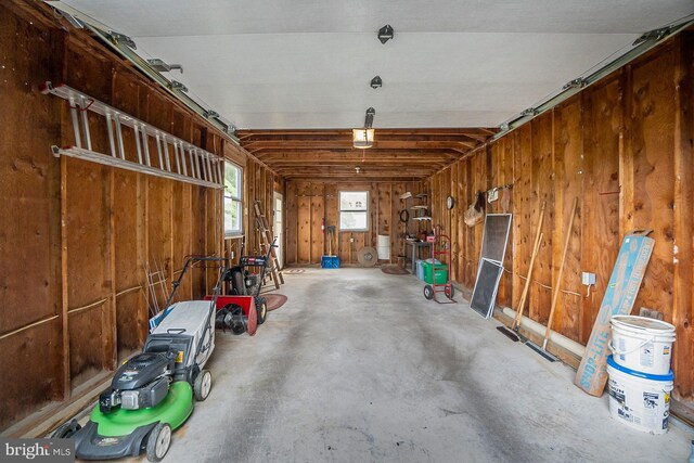1402 Lehigh St, Allentown, PA 18103 - garage featuring a garage door opener and wood walls