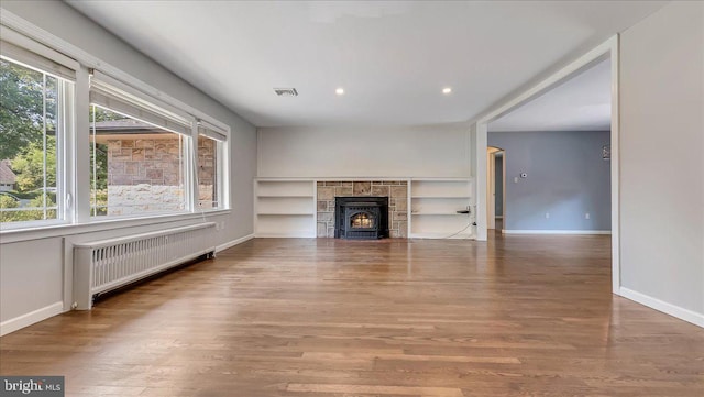 2705 W Gordon, Allentown, PA 18104 - unfurnished living room featuring radiator, healthy amount of natural light, wood finished floors, and recessed lighting