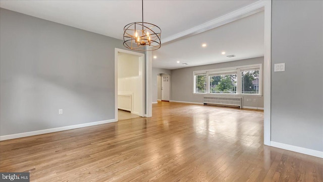 2705 W Gordon, Allentown, PA 18104 - unfurnished room featuring radiator heating unit, a chandelier, light wood-style floors, recessed lighting, and arched walkways