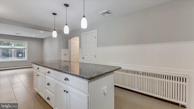 2705 W Gordon, Allentown, PA 18104 - kitchen featuring radiator heating unit, baseboard heating, light tile patterned floors, arched walkways, and wainscoting