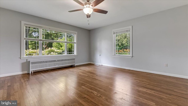 2705 W Gordon, Allentown, PA 18104 - empty room featuring radiator heating unit, a ceiling fan, and hardwood / wood-style floors