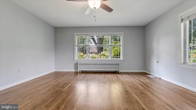2705 W Gordon, Allentown, PA 18104 - spare room featuring radiator, wood finished floors, and a ceiling fan