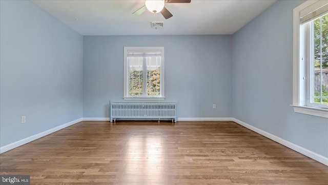 2705 W Gordon, Allentown, PA 18104 - unfurnished room with radiator heating unit, a ceiling fan, and wood finished floors