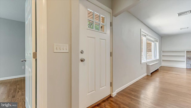 2705 W Gordon, Allentown, PA 18104 - entryway with wood finished floors and radiator