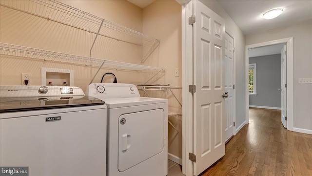 2705 W Gordon, Allentown, PA 18104 - laundry area with washing machine and clothes dryer and wood finished floors