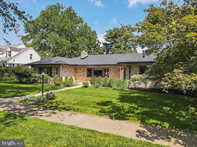 2705 W Gordon, Allentown, PA 18104 - view of front facade featuring a front yard, a chimney, and stone siding