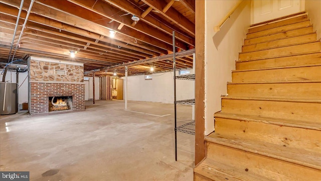 2705 W Gordon, Allentown, PA 18104 - unfinished below grade area with water heater, stairway, and a fireplace