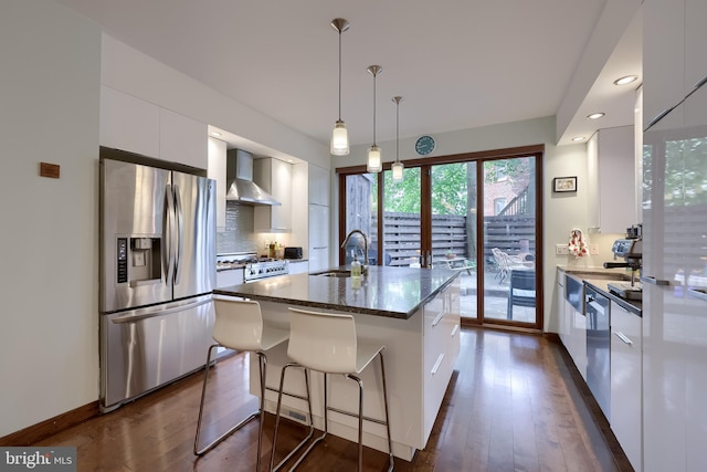 662 W Chestnut St, Lancaster, PA 17603 - kitchen featuring stainless steel appliances, wall chimney range hood, modern cabinets, white cabinetry, and dark wood-style floors
