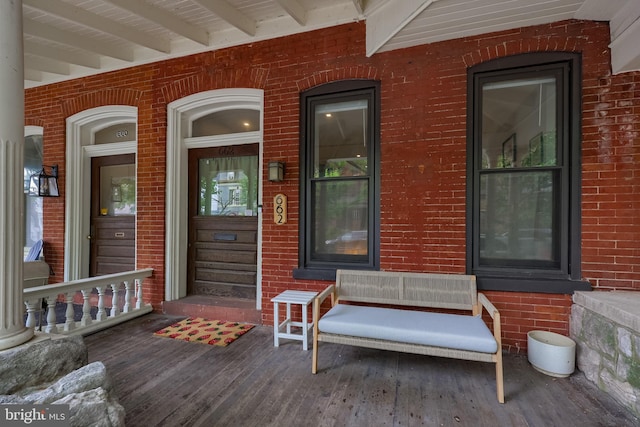 662 W Chestnut St, Lancaster, PA 17603 - view of exterior entry featuring brick siding and a porch
