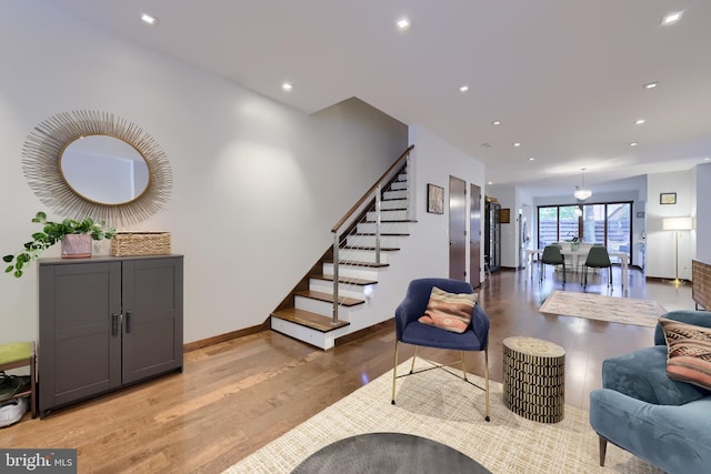 662 W Chestnut St, Lancaster, PA 17603 - living room featuring light wood-style flooring, stairway, and recessed lighting