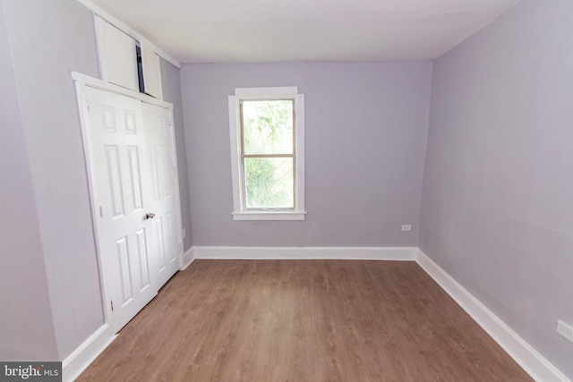631 Saint Anns Ave, Baltimore, MD 21218 - unfurnished bedroom featuring light wood-style floors and a closet