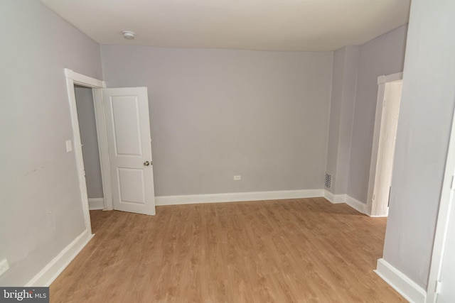631 Saint Anns Ave, Baltimore, MD 21218 - spare room featuring light wood-type flooring and a smoke detector