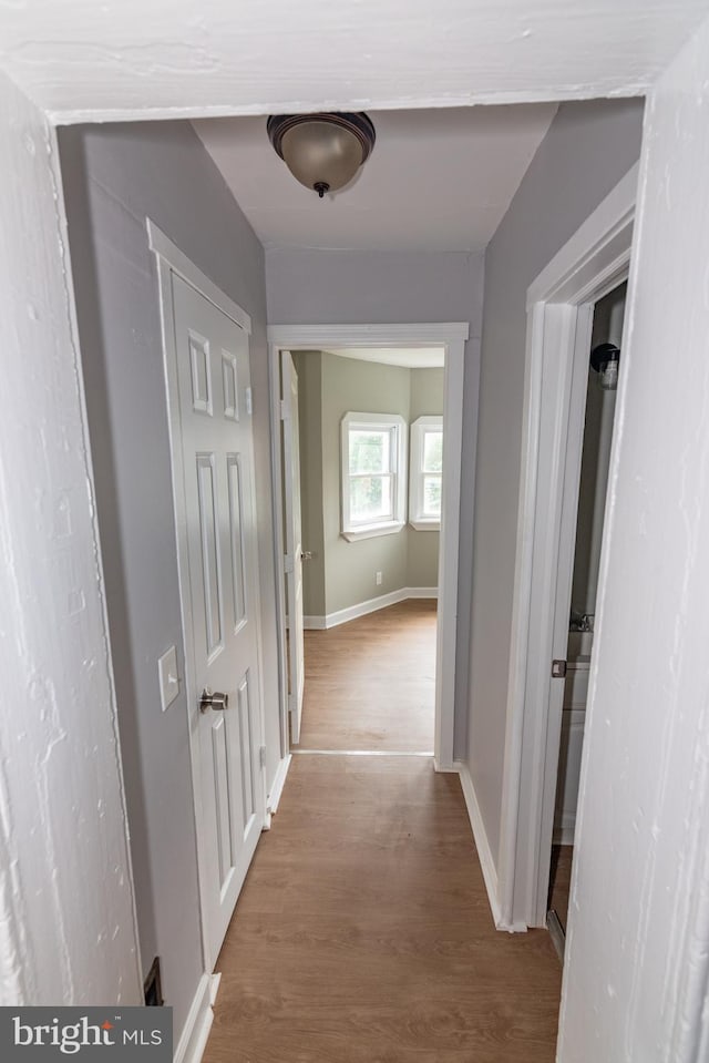 631 Saint Anns Ave, Baltimore, MD 21218 - hallway with wood finished floors and baseboards