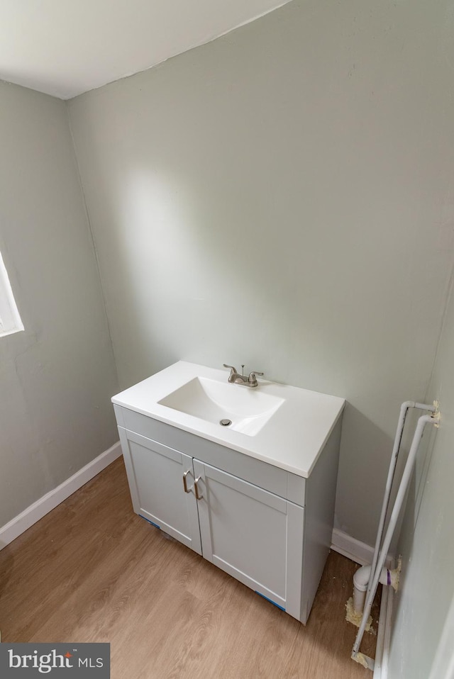 631 Saint Anns Ave, Baltimore, MD 21218 - bathroom with wood finished floors and vanity