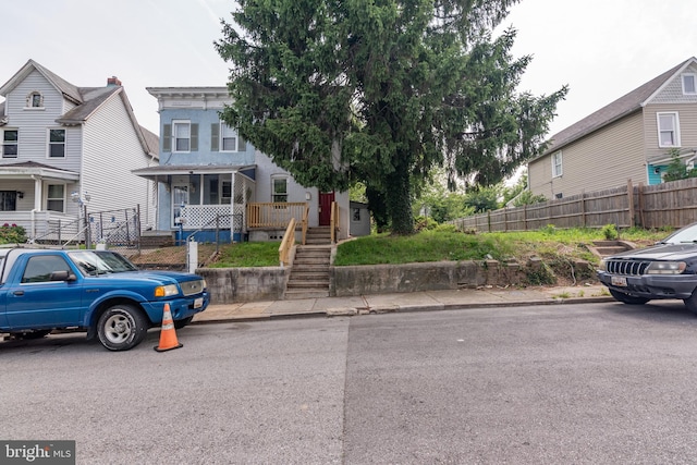 631 Saint Anns Ave, Baltimore, MD 21218 - view of front of home featuring covered porch and stairs