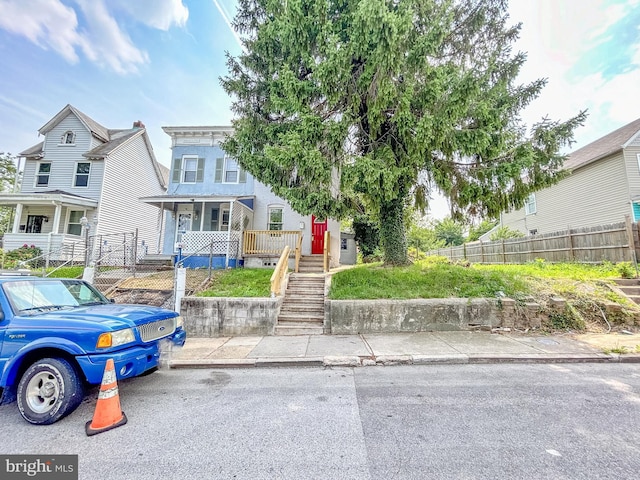 631 Saint Anns Ave, Baltimore, MD 21218 - view of front of property featuring stairway and covered porch