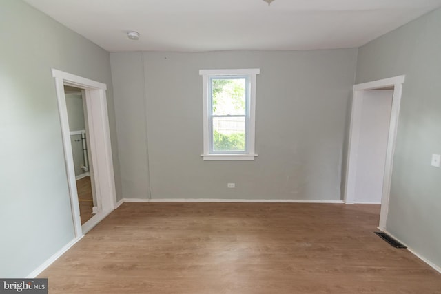 631 Saint Anns Ave, Baltimore, MD 21218 - spare room featuring a smoke detector and light wood-type flooring