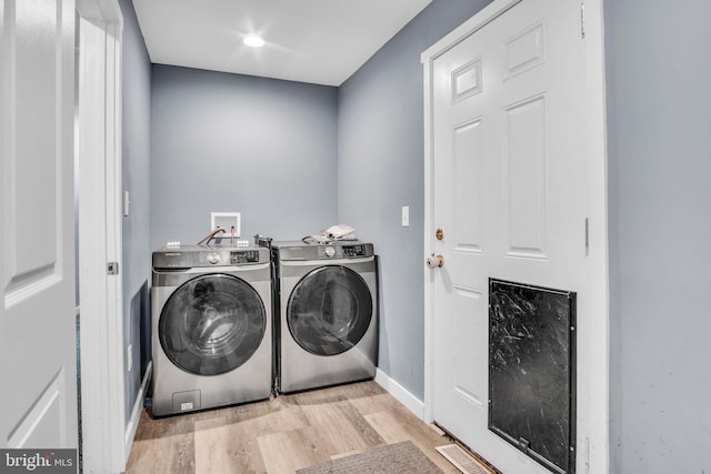 60 Gordon Dr, Carlisle, PA 17013 - laundry room with washing machine and dryer and wood finished floors