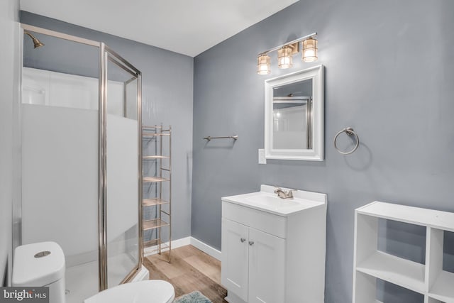 60 Gordon Dr, Carlisle, PA 17013 - bathroom with a stall shower, vanity, and wood finished floors