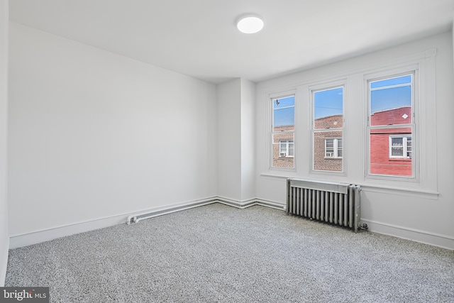1439 S 28th St, Philadelphia, PA 19146 - unfurnished room featuring radiator heating unit and carpet