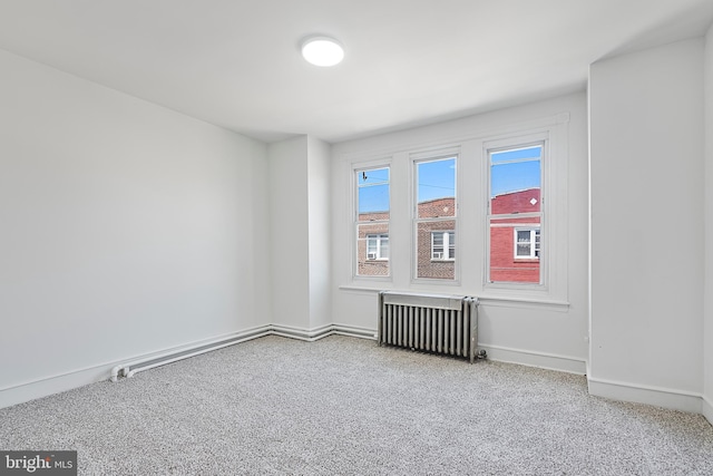 1439 S 28th St, Philadelphia, PA 19146 - empty room featuring radiator and carpet floors