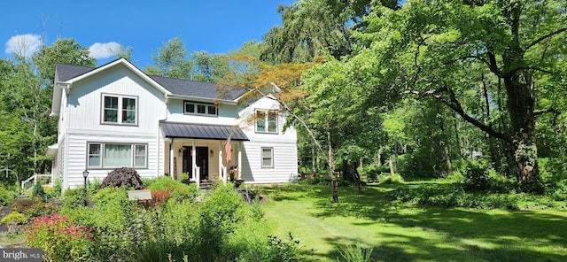 73 Bayberry Rd, Princeton, NJ 08540 - view of front of home with a standing seam roof, a front lawn, and a metal roof