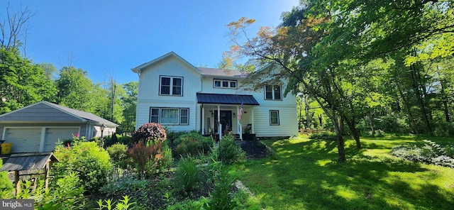 73 Bayberry Rd, Princeton, NJ 08540 - view of front of house with a front lawn, a garage, an outdoor structure, a standing seam roof, and a metal roof