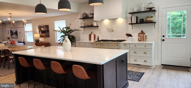 73 Bayberry Rd, Princeton, NJ 08540 - kitchen with open shelves, light wood-style floors, light countertops, and a breakfast bar area