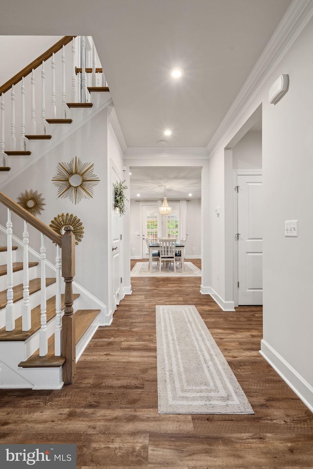 303 Petunia Way, Stafford, VA 22554 - hall featuring stairway, wood finished floors, crown molding, recessed lighting, and a chandelier