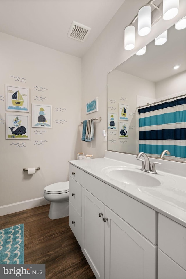 303 Petunia Way, Stafford, VA 22554 - full bath with vanity, wood finished floors, and a shower with shower curtain