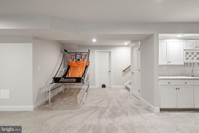 303 Petunia Way, Stafford, VA 22554 - finished basement featuring carpet floors, recessed lighting, stairway, and bar with sink