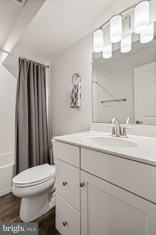 303 Petunia Way, Stafford, VA 22554 - bathroom featuring vanity, wood finished floors, and shower / tub combo with curtain