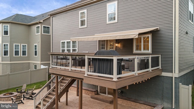 303 Petunia Way, Stafford, VA 22554 - rear view of house with an outdoor fire pit, a wooden deck, and a patio