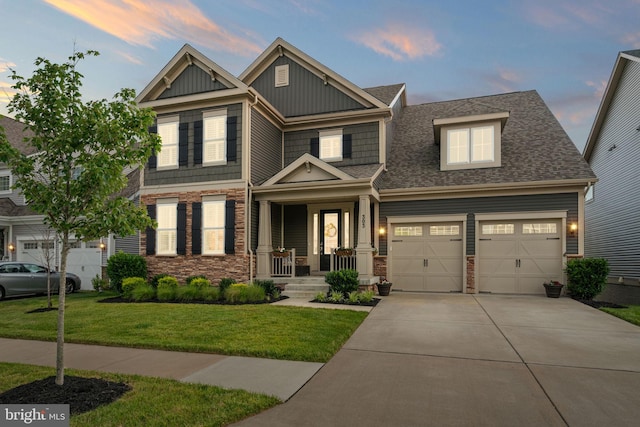 303 Petunia Way, Stafford, VA 22554 - craftsman-style house with stone siding, board and batten siding, driveway, a front lawn, and a shingled roof