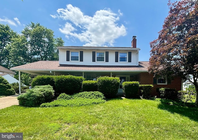109 Staton Dr, Upper Marlboro, MD 20774 - view of front of house with a chimney and a front lawn