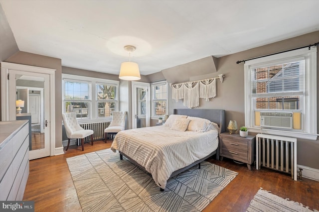 828 Turner Ave, Drexel Hill, PA 19026 - bedroom featuring radiator heating unit, cooling unit, and dark wood-style floors