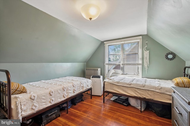 828 Turner Ave, Drexel Hill, PA 19026 - bedroom with radiator heating unit, wood-type flooring, and vaulted ceiling