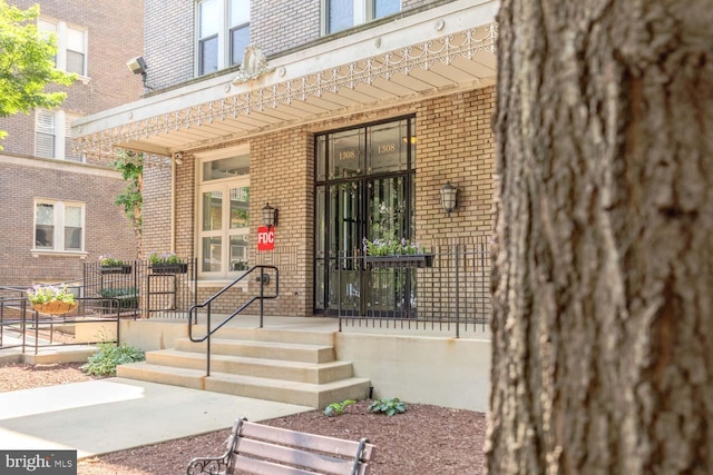 1308 Clifton St NW Unit 118, Washington, DC 20009 - property entrance with brick siding and covered porch