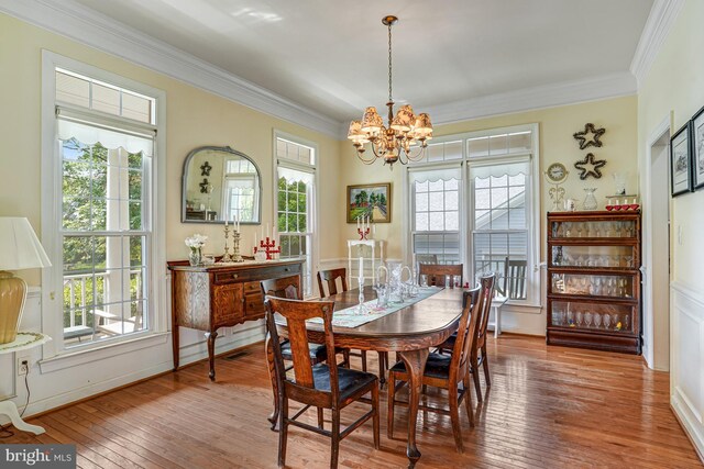 25072 Gazelle Ct, Chantilly, VA 20152 - dining space featuring a chandelier, hardwood / wood-style floors, and crown molding