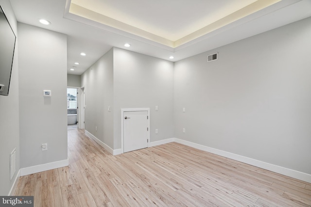 1448 N Myrtlewood St, Philadelphia, PA 19121 - unfurnished room with recessed lighting, light wood finished floors, and a raised ceiling