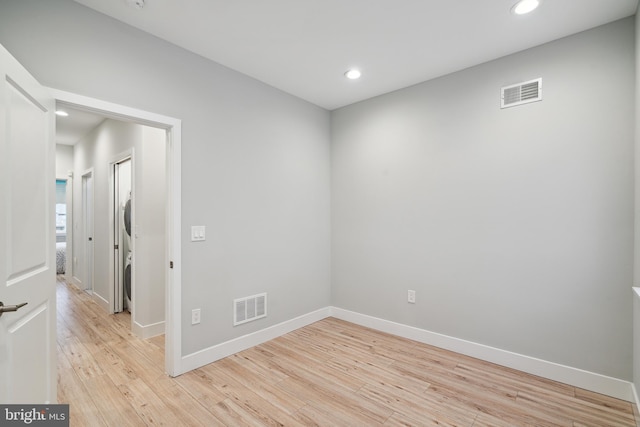 1448 N Myrtlewood St, Philadelphia, PA 19121 - unfurnished room with stacked washer / drying machine, light wood-style flooring, and recessed lighting