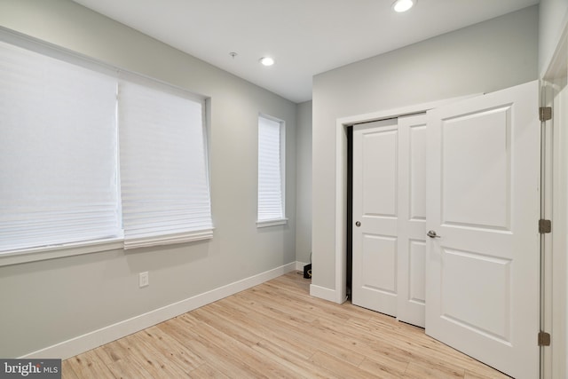 1448 N Myrtlewood St, Philadelphia, PA 19121 - unfurnished bedroom with light wood finished floors, recessed lighting, and a closet