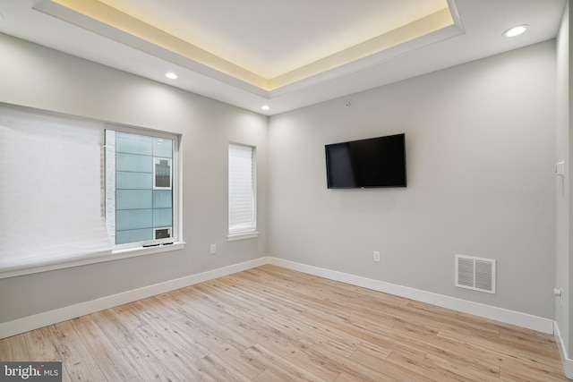 1448 N Myrtlewood St, Philadelphia, PA 19121 - empty room with light wood finished floors, recessed lighting, and a tray ceiling
