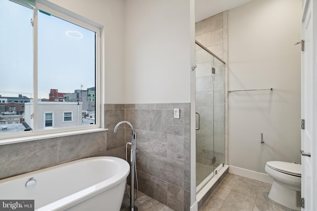 1448 N Myrtlewood St, Philadelphia, PA 19121 - full bathroom with a freestanding tub, a stall shower, and tile patterned flooring