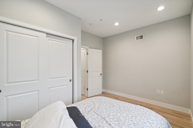 1448 N Myrtlewood St, Philadelphia, PA 19121 - bedroom with a closet, light wood-style floors, and recessed lighting