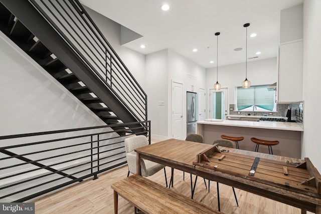 1448 N Myrtlewood St, Philadelphia, PA 19121 - dining space with light wood finished floors, recessed lighting, and stairs