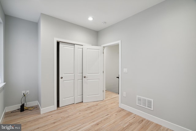 1448 N Myrtlewood St, Philadelphia, PA 19121 - unfurnished bedroom with light wood-type flooring, a closet, and recessed lighting