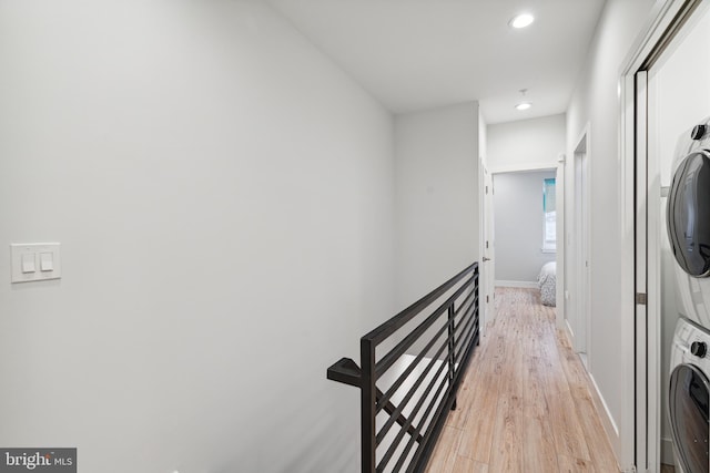 1448 N Myrtlewood St, Philadelphia, PA 19121 - laundry area with stacked washer / drying machine, light wood-style floors, and recessed lighting